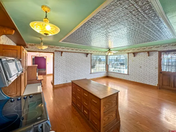 a room with wooden cabinets and outdoor seating