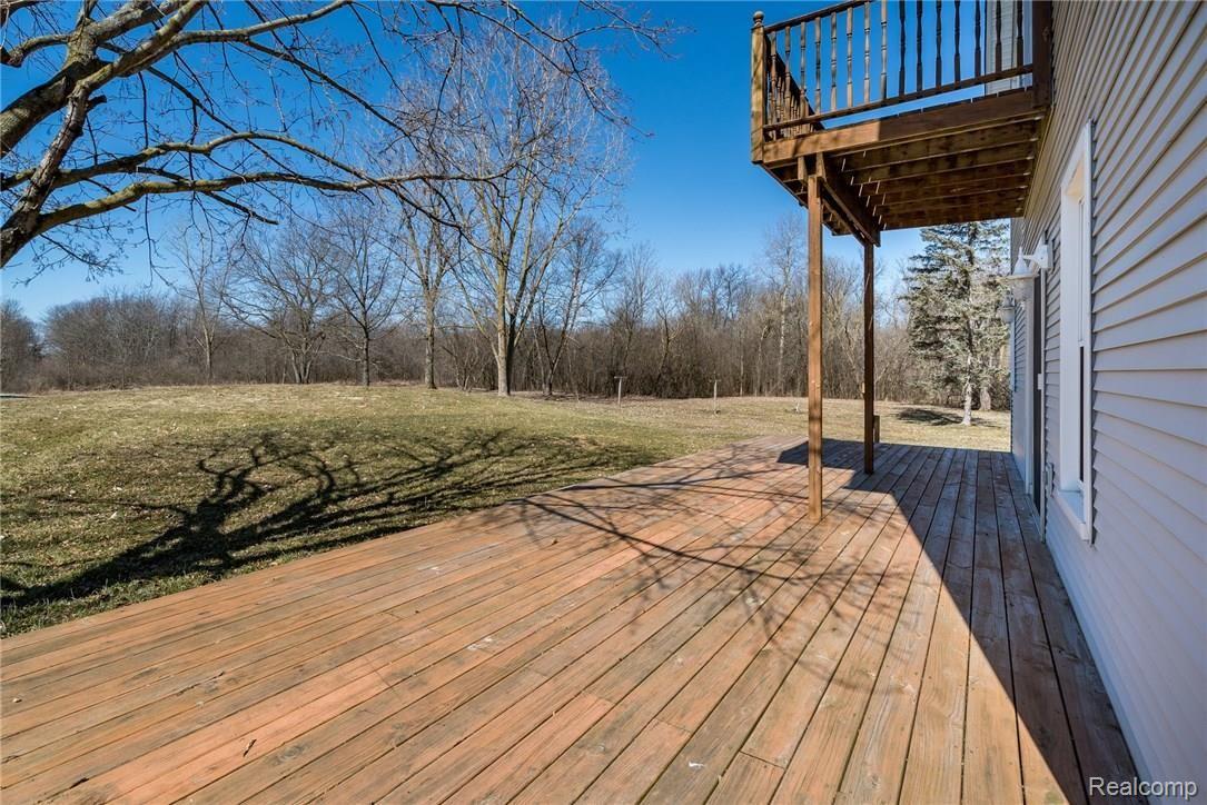 1290 7 Mile Road Whitmore Lake, MI 48189 - Photo 31 of 34 Deck and Balcony with View of Trees