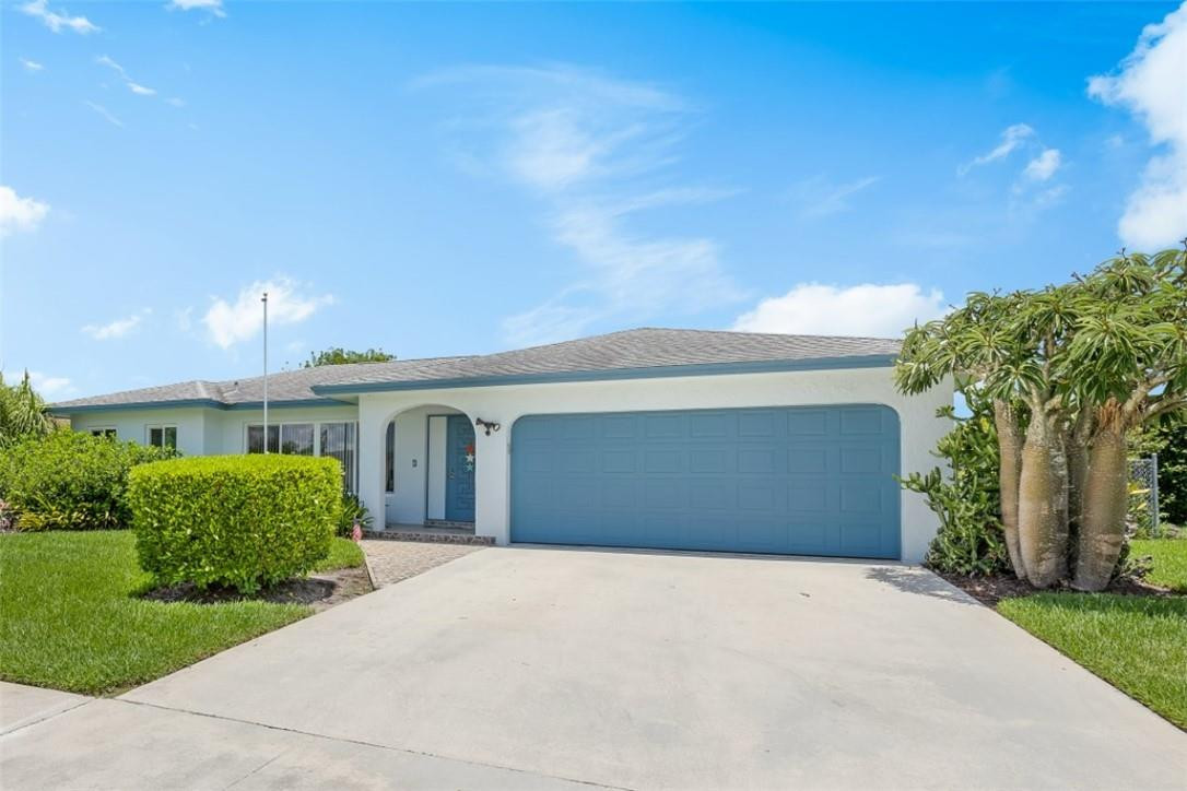 4625 Appalachian Street Boca Raton, FL 33428 - Photo 1 of 24 a front view of a house with a yard and garage