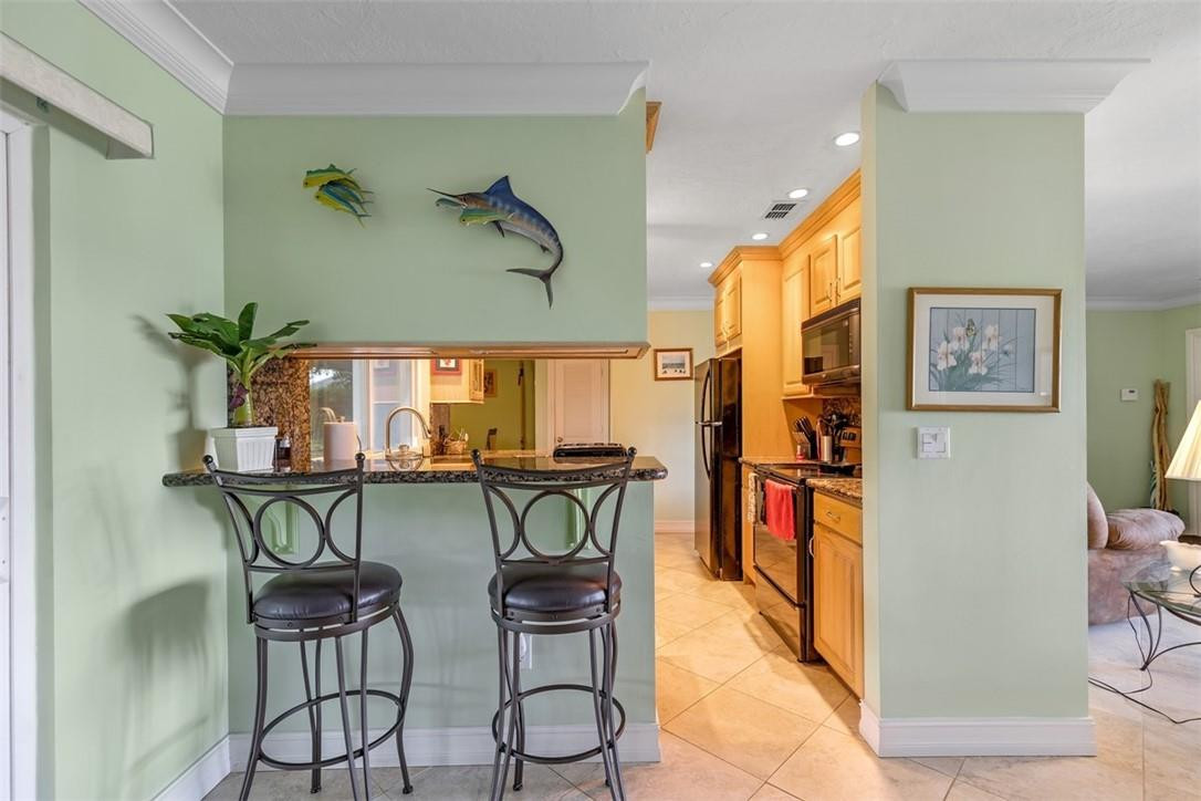 4625 Appalachian Street Boca Raton, FL 33428 - Photo 17 of 24 a dinning table and chairs in a room