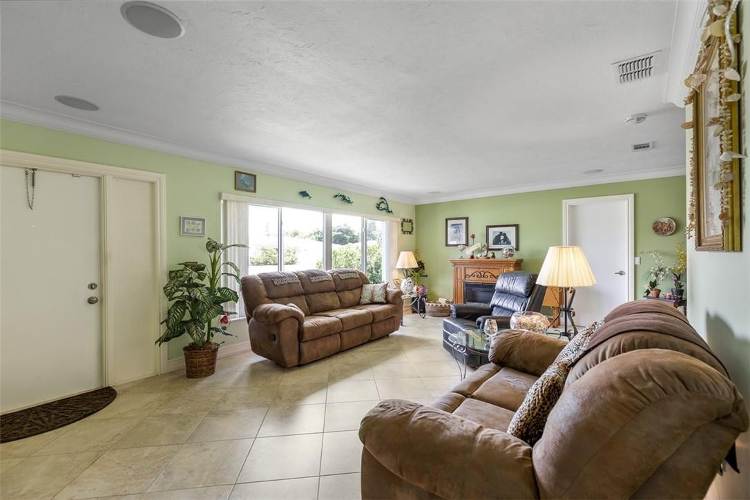 4625 Appalachian Street Boca Raton, FL 33428 - Photo 4 of 24 a living room with furniture and a chandelier