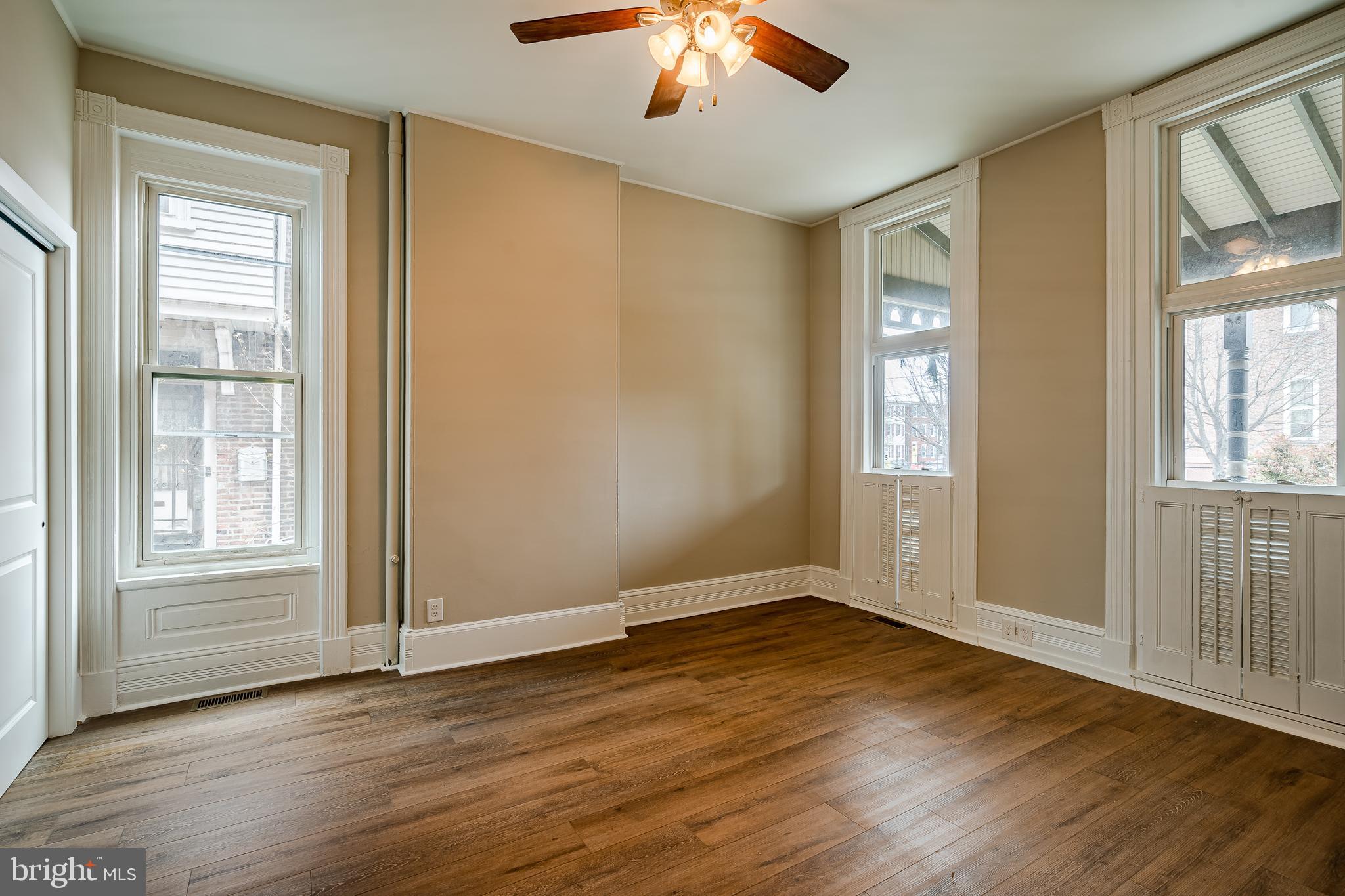 144 Gay Street, Unit 1 Phoenixville, PA 19460 - Photo 12 of 22 wooden floor in an empty room with a window