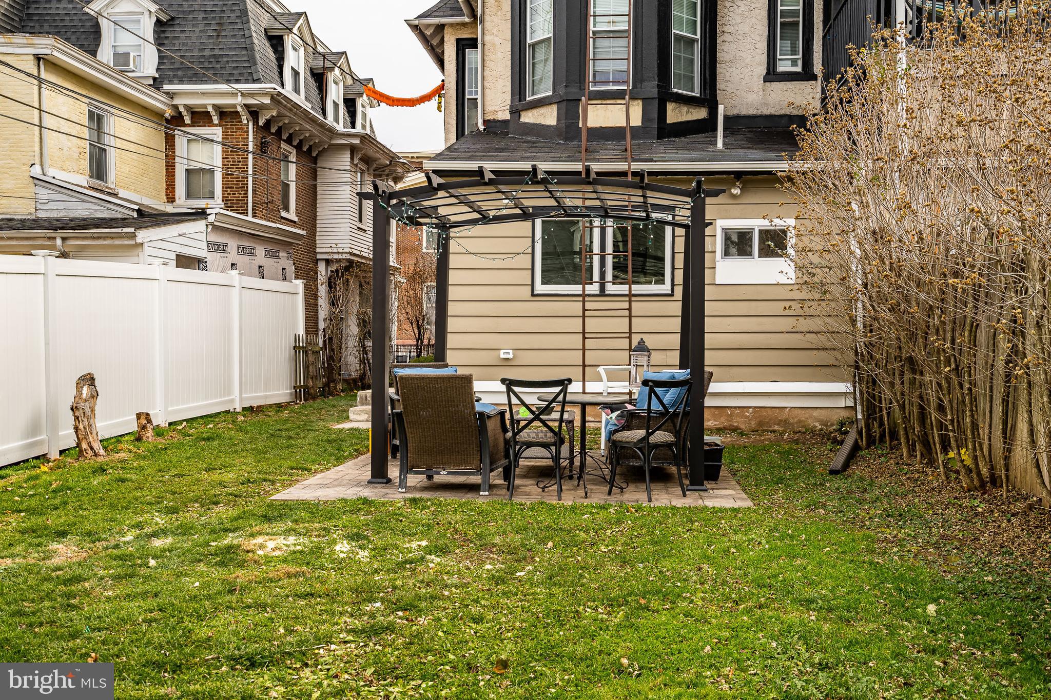 144 Gay Street, Unit 1 Phoenixville, PA 19460 - Photo 19 of 22 a backyard of a house with table and chairs