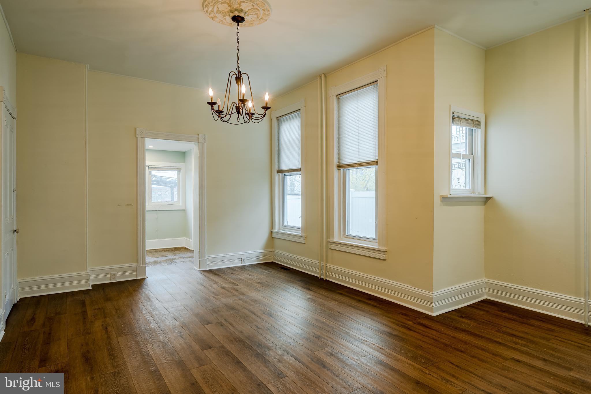 144 Gay Street, Unit 1 Phoenixville, PA 19460 - Photo 7 of 22 a view of livingroom with hardwood floor and window