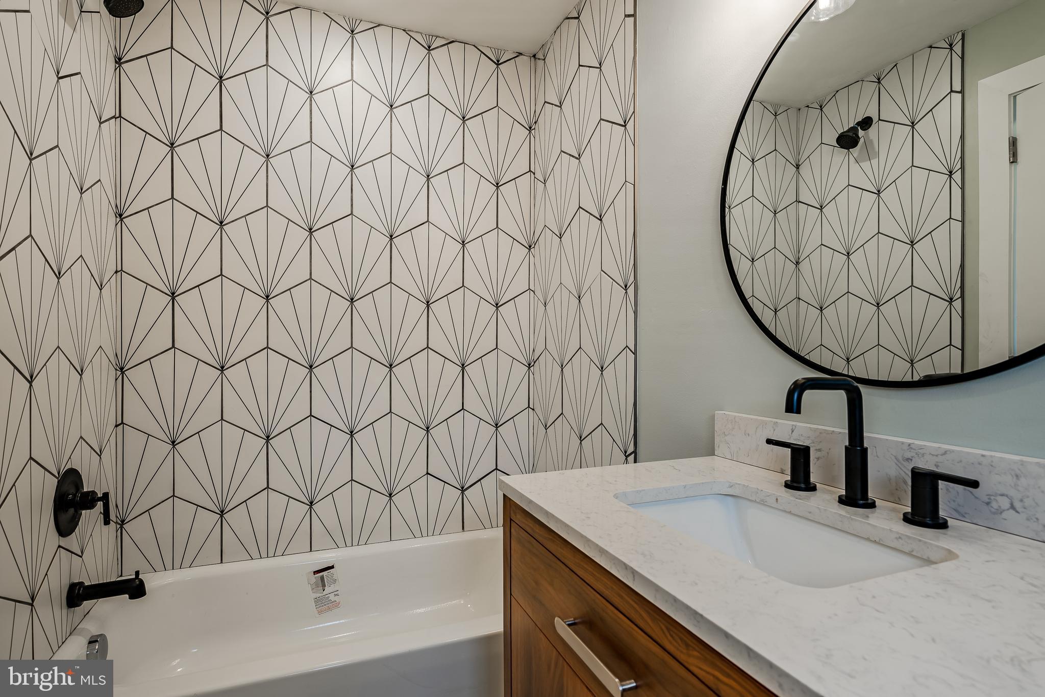 144 Gay Street, Unit 1 Phoenixville, PA 19460 - Photo 9 of 22 a bathroom with a sink and a mirror