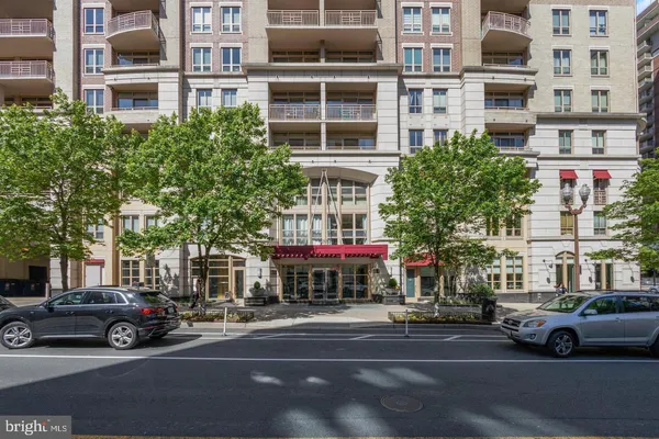 a view of a street that has couple of cars parked on the road