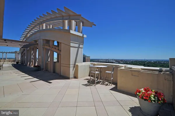a view of a terrace with sitting area