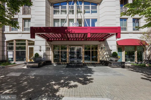 a view of a building with sitting area