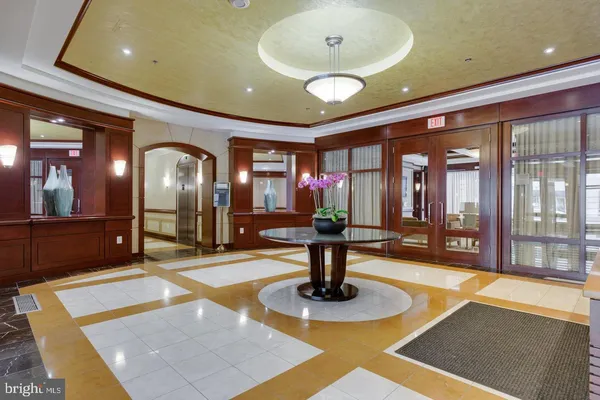a lobby with table and chairs
