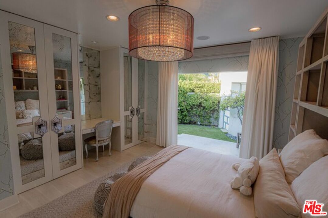 1425 Devlin Drive Los Angeles, CA 90069 - Photo 11 of 15 a bedroom with furniture and a large window