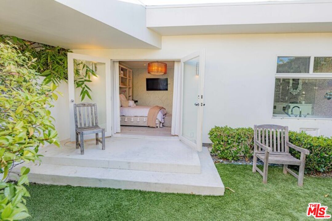 1425 Devlin Drive Los Angeles, CA 90069 - Photo 12 of 15 a view of a porch with furniture and garden