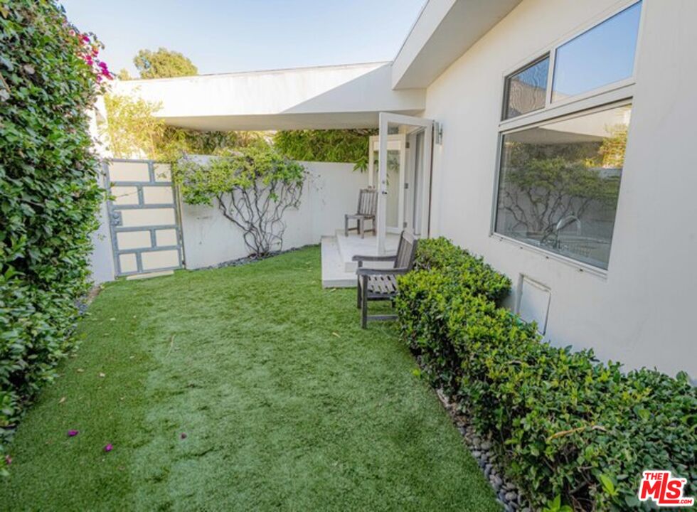 1425 Devlin Drive Los Angeles, CA 90069 - Photo 14 of 15 a view of a backyard with garden