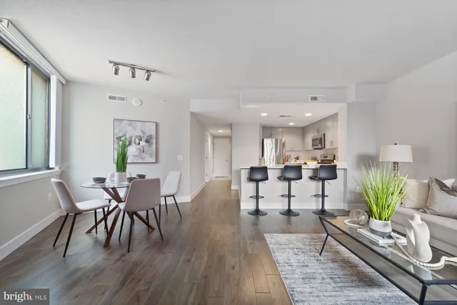a view of a dining room with furniture and wooden floor