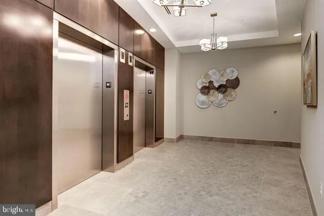 a view of a hallway with a chandelier