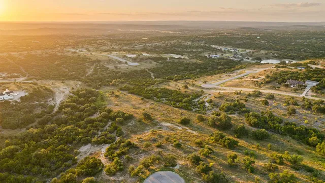 an aerial view of residential houses with ocean view