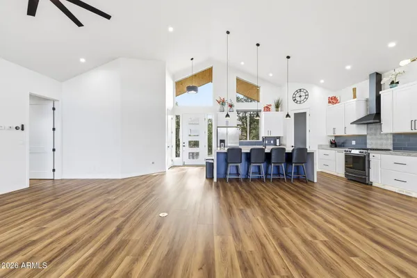 a view of a livingroom with a fireplace and wooden floor
