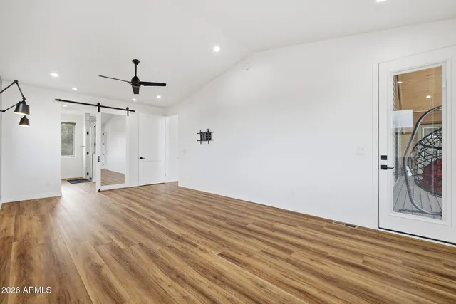 a spacious bathroom with a double vanity sink and a mirror