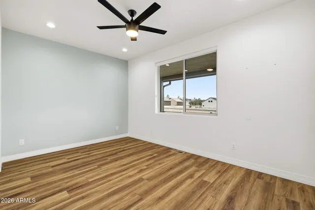 a bathroom with a sink a toilet and a large mirror