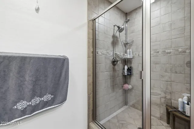 a view of a swimming pool with a bench in the background