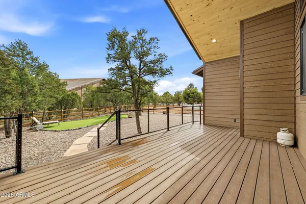 a picture of a room with a white wall and a refrigerator
