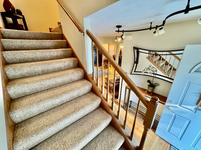 a bed room with a bed and a window