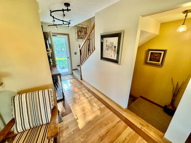 a view of a hallway with a dining area