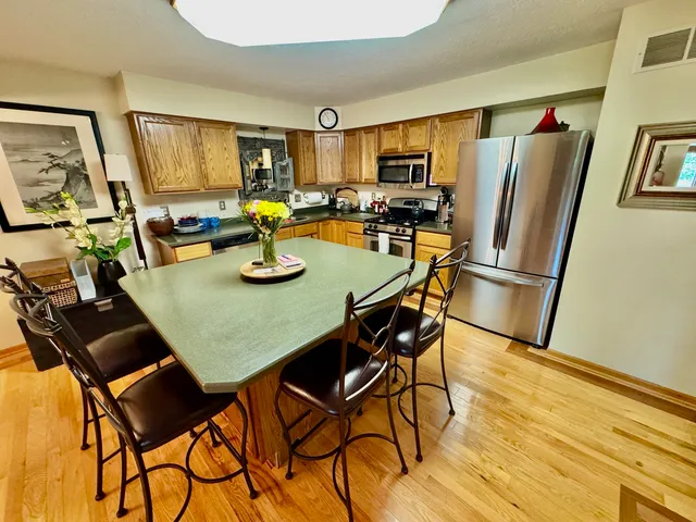 a view of kitchen with dining table and chairs