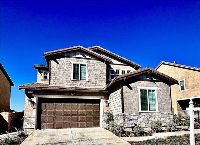 a front view of a house with yard