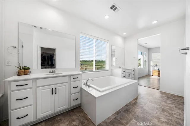 a kitchen with a refrigerator and a stove