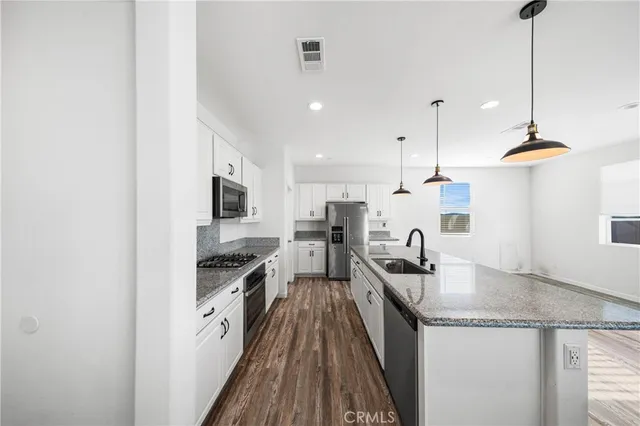 a bathroom with a sink toilet and vanity