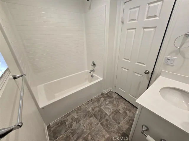 a bathroom with a sink and a tub