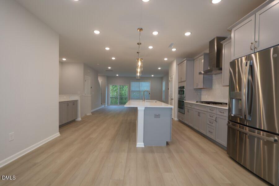 2913 Richardson Road, Unit 475 Apex, NC 27502 - Photo 12 of 24 a kitchen with refrigerator and microwave