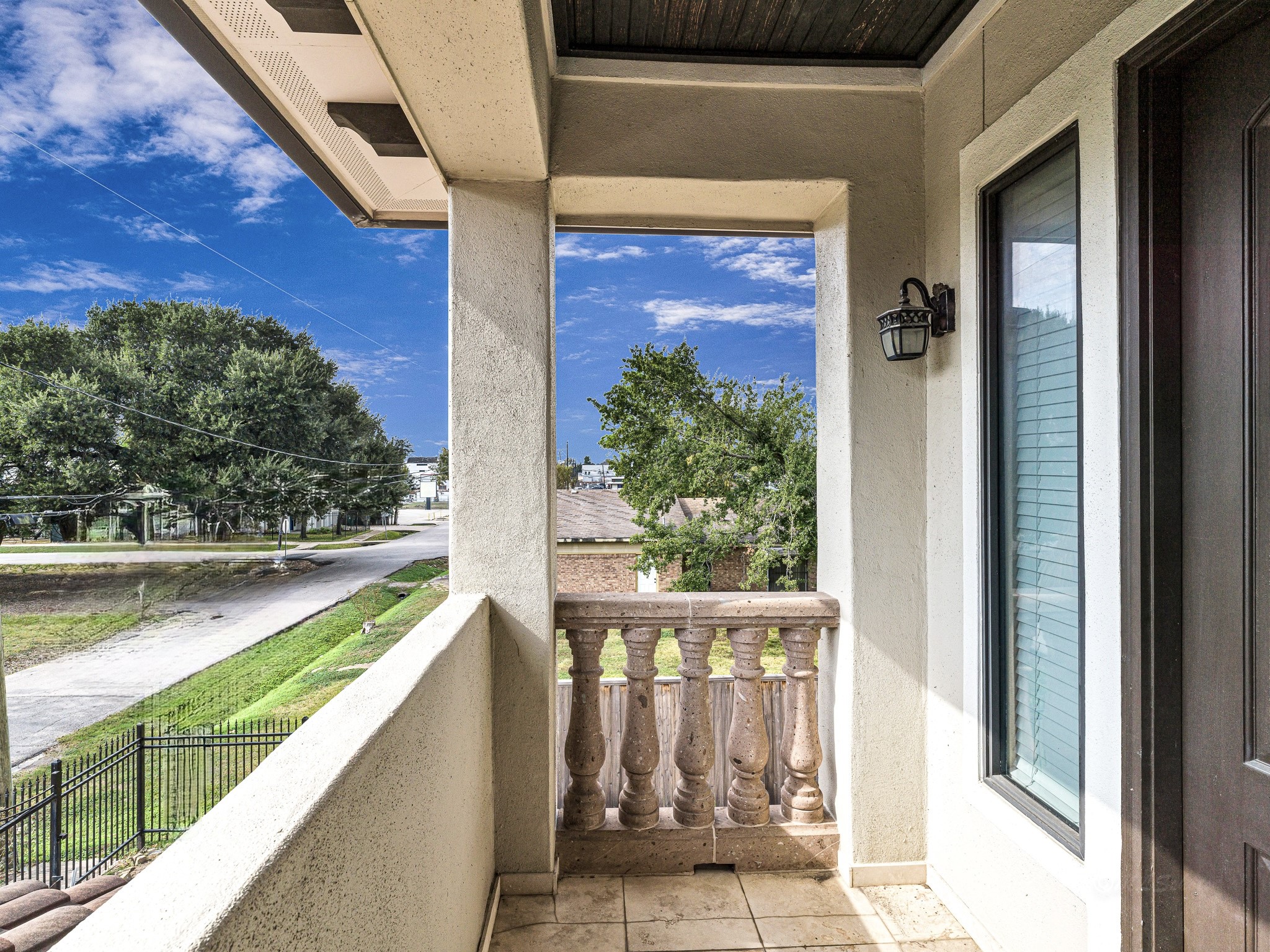 4614 Inker Street Houston, TX 77007 - Photo 31 of 36 Charming balcony off the game room with a classic balustrade and view of the neighborhood.