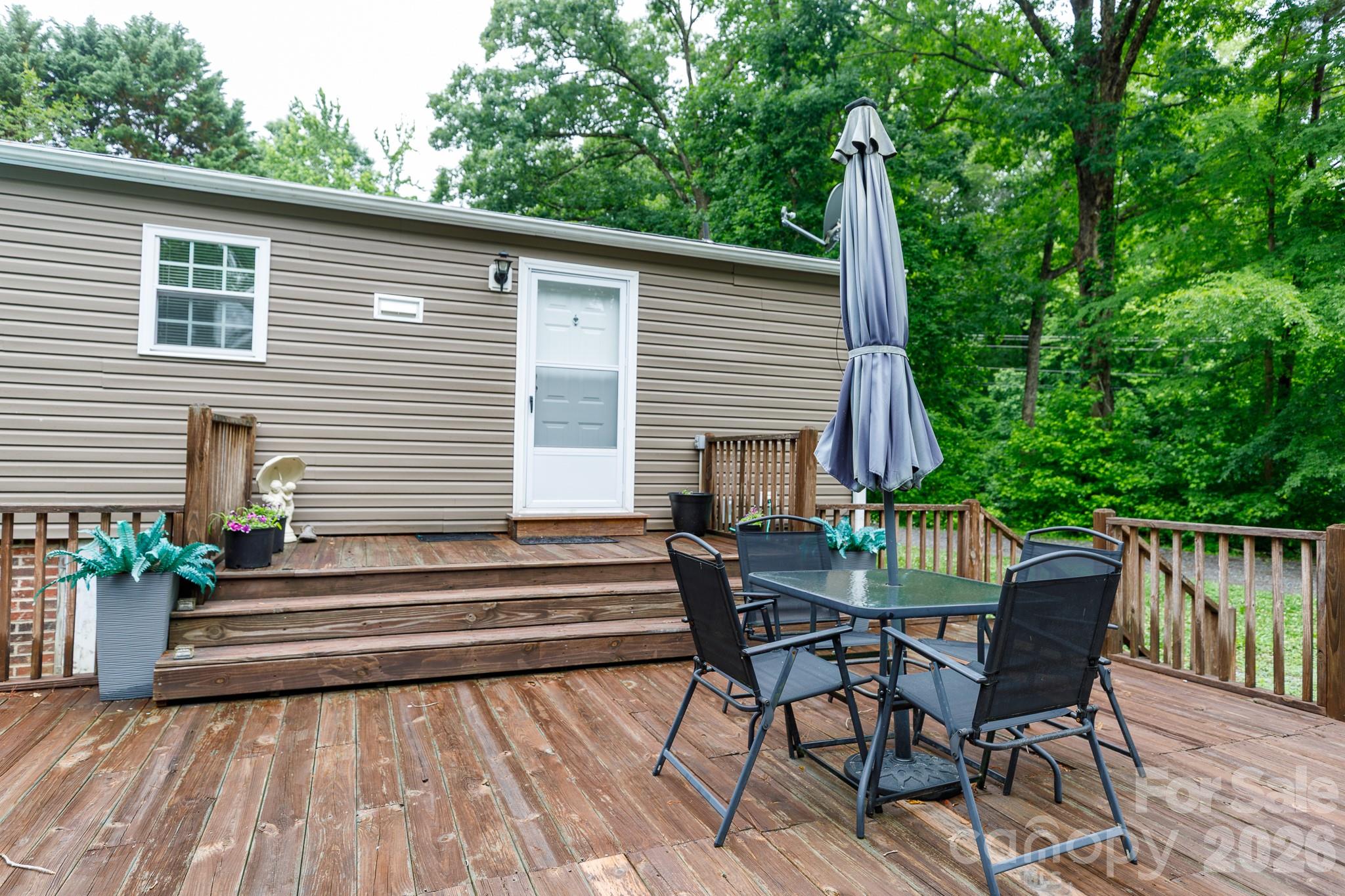 652 Sutton Spring Road York, SC 29745 - Photo 21 of 28 a view of a patio with a table and chairs