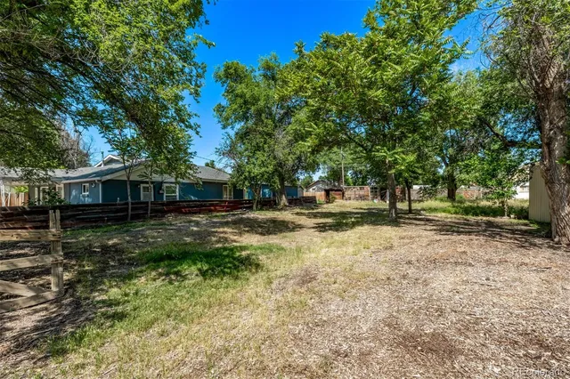 a backyard of a house with lots of green space