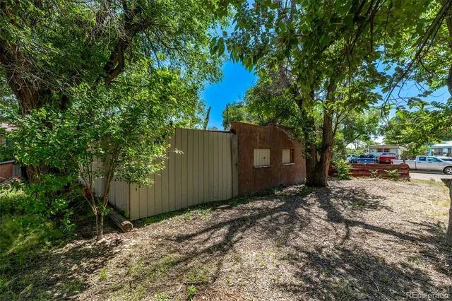 a backyard of a house with lots of green space