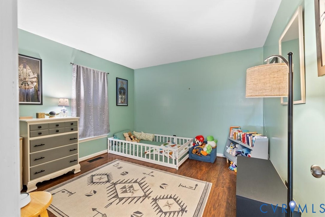 12505 Mandolin Drive Midlothian, VA 23113 - Photo 12 of 26 a bedroom with furniture and a wooden floor
