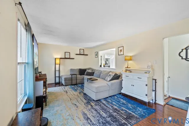 a living room with furniture and a table