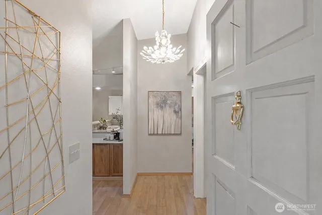 a bathroom with a mirror sink and shower