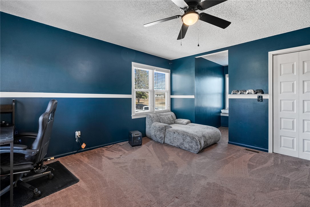 112 C-10-220 Anderson, SC 29621 - Photo 37 of 45 This cozy bedroom features a ceiling fan, a window, and comfortable carpeting.