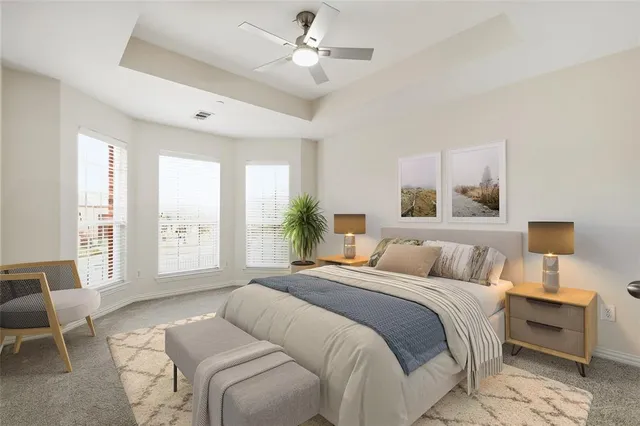 a bedroom with a large bed and a window