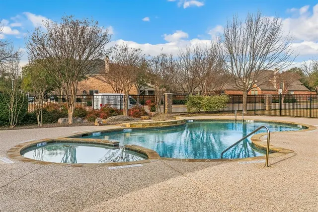 a view of yard with swimming pool and green space