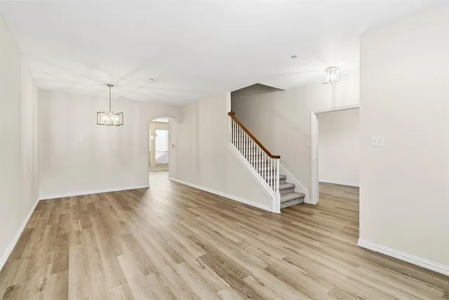 a view of an entryway with wooden floor