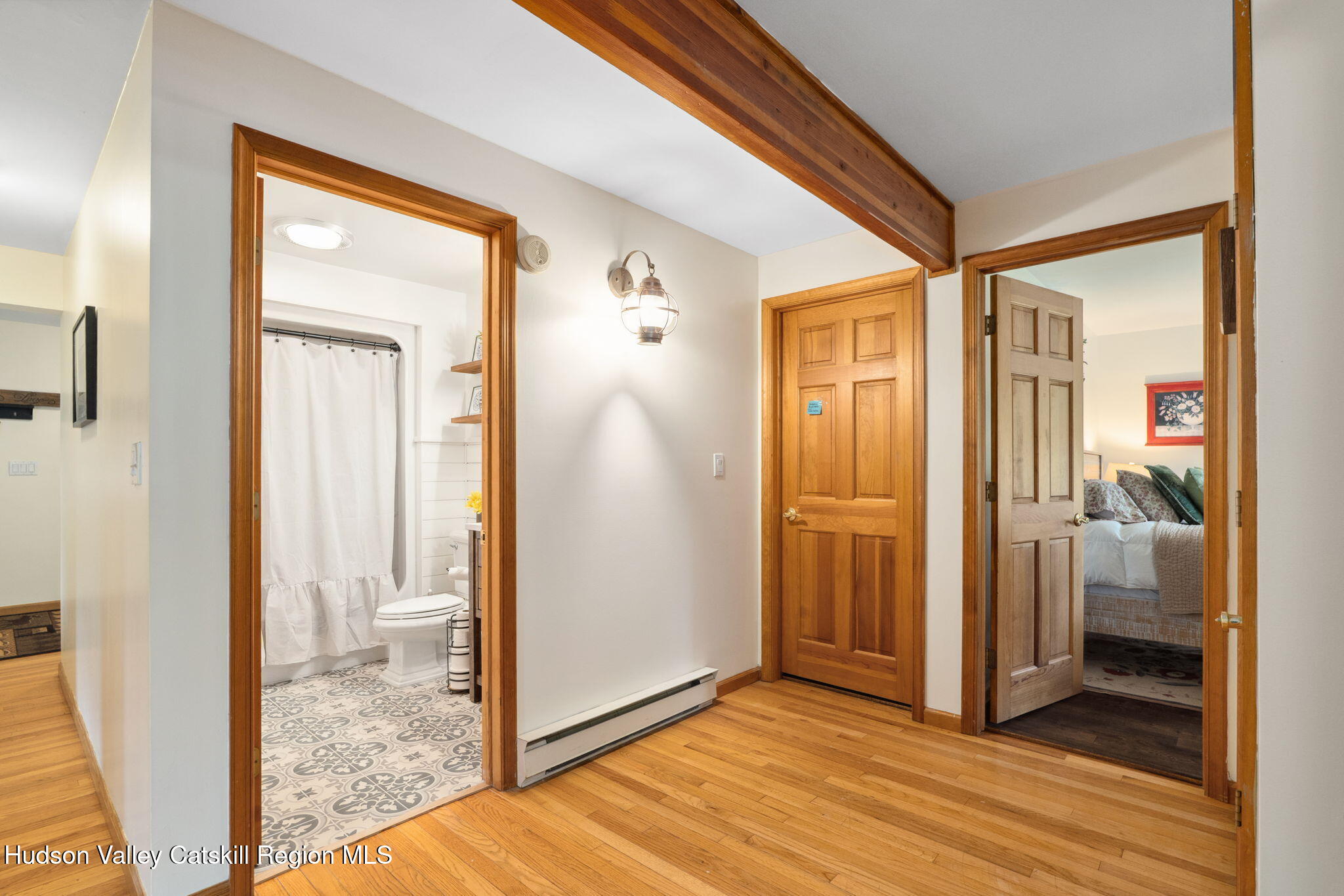 552 Bear Kill Road Gilboa, NY 12076 - Photo 13 of 63 a view of a bathroom with a glass door and a window