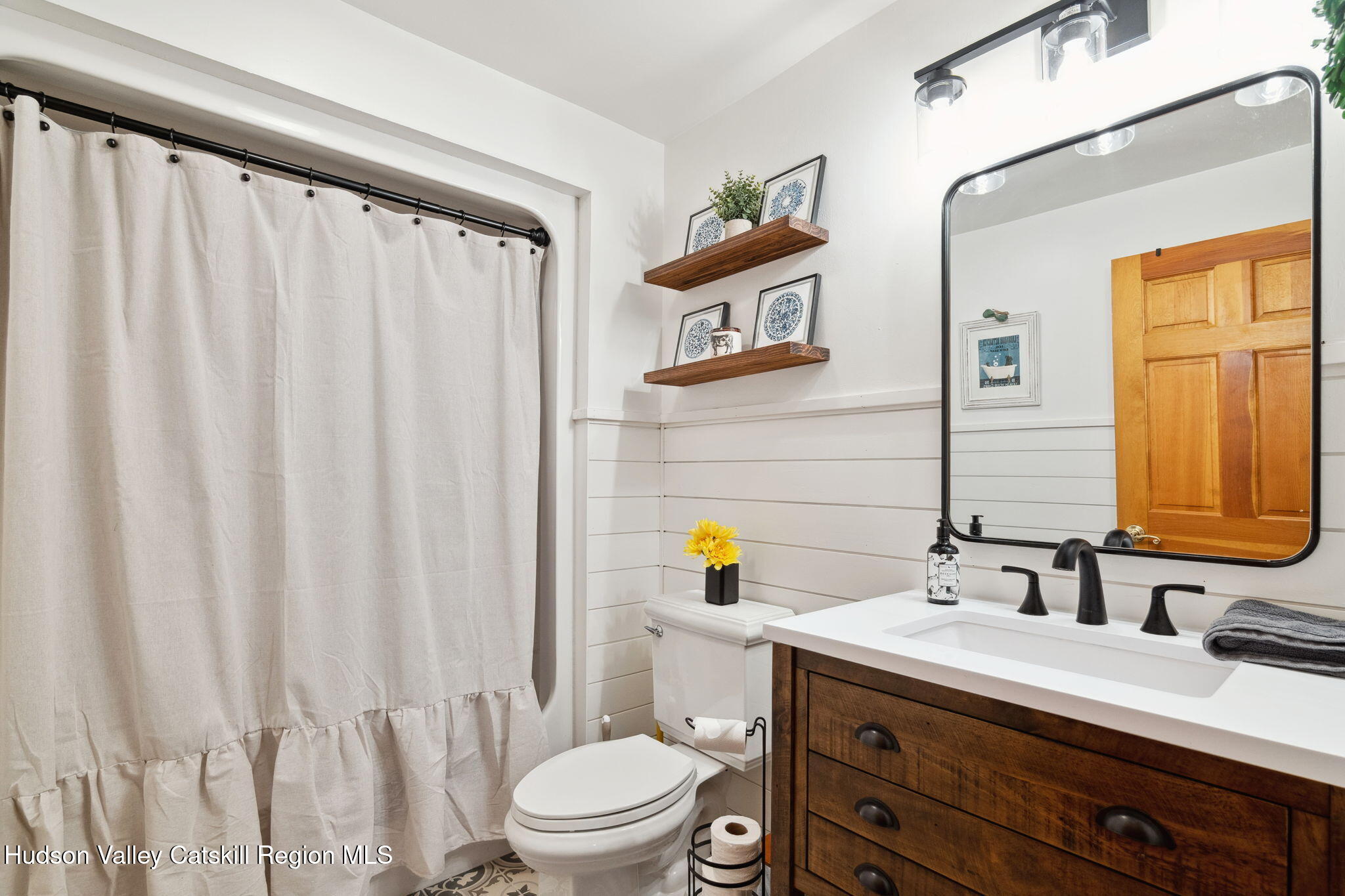552 Bear Kill Road Gilboa, NY 12076 - Photo 14 of 63 a bathroom with a sink a toilet and shower curtain