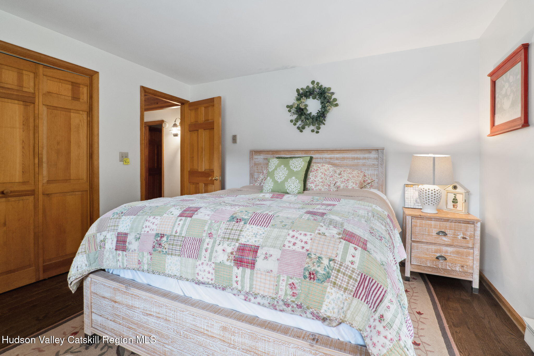 552 Bear Kill Road Gilboa, NY 12076 - Photo 16 of 63 a bedroom with a bed and a painting on the wall