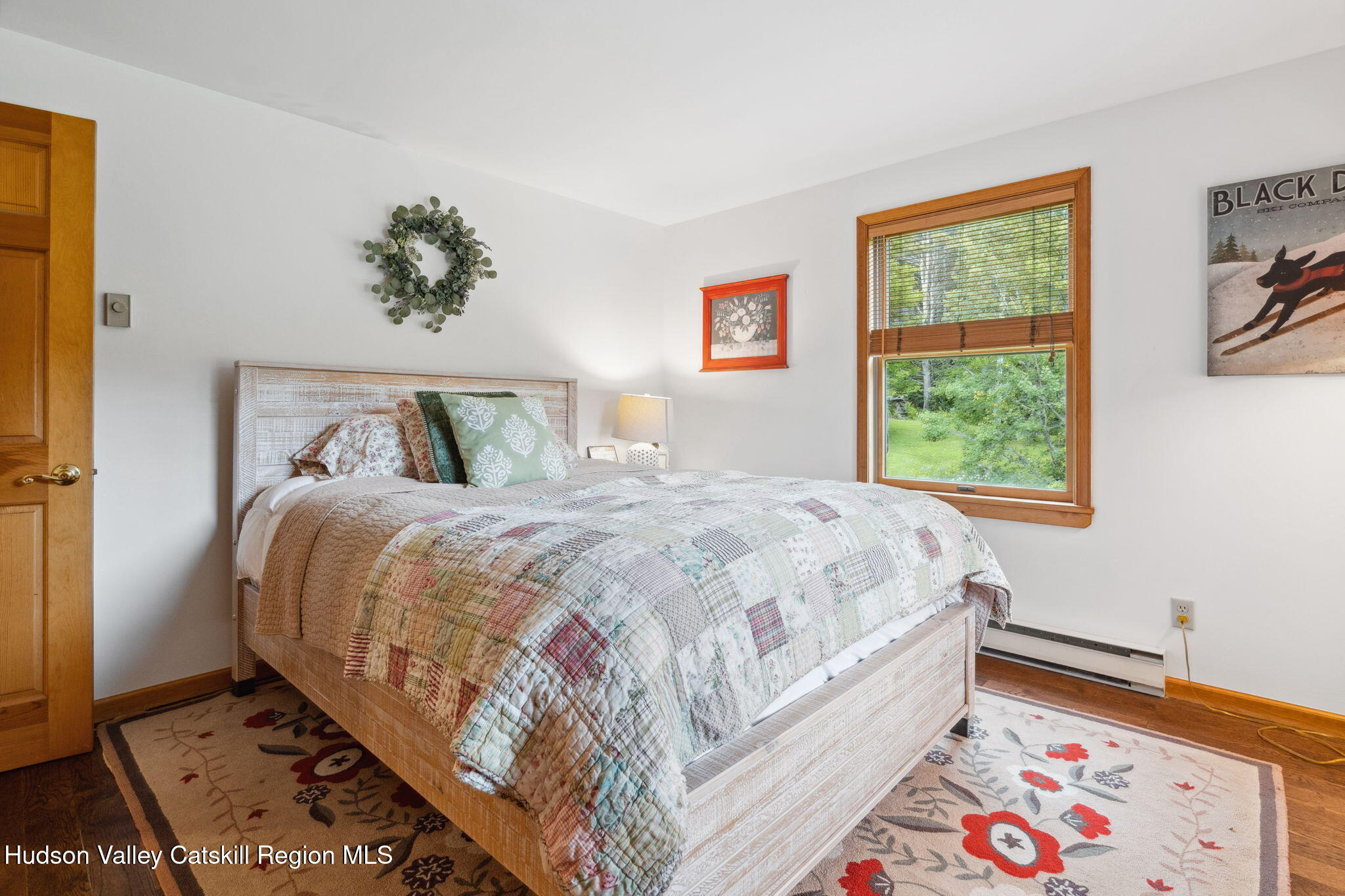 552 Bear Kill Road Gilboa, NY 12076 - Photo 18 of 63 a bed sitting in a bedroom next to a window