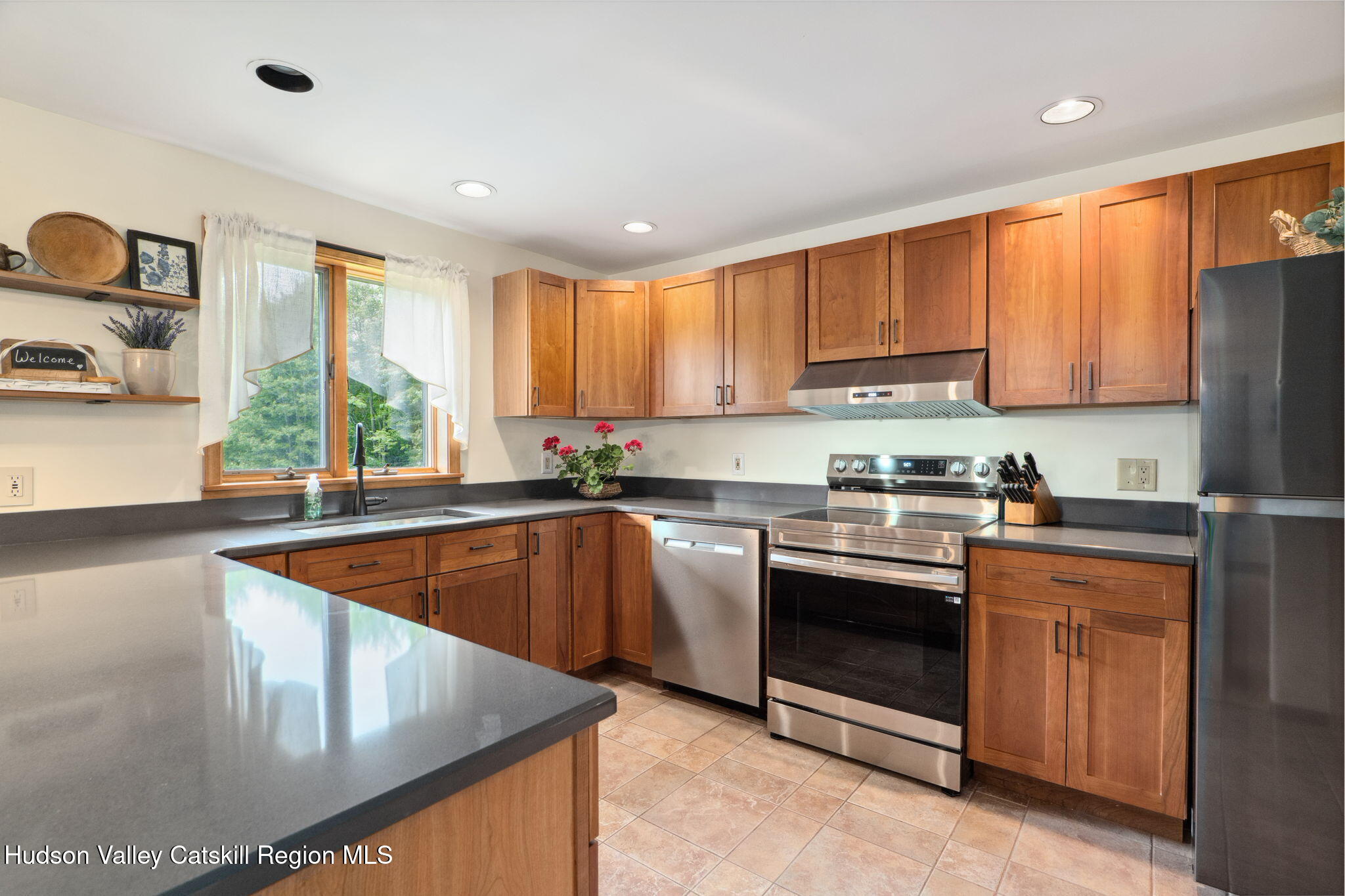 552 Bear Kill Road Gilboa, NY 12076 - Photo 22 of 63 a kitchen with stainless steel appliances granite countertop a sink a stove and a refrigerator