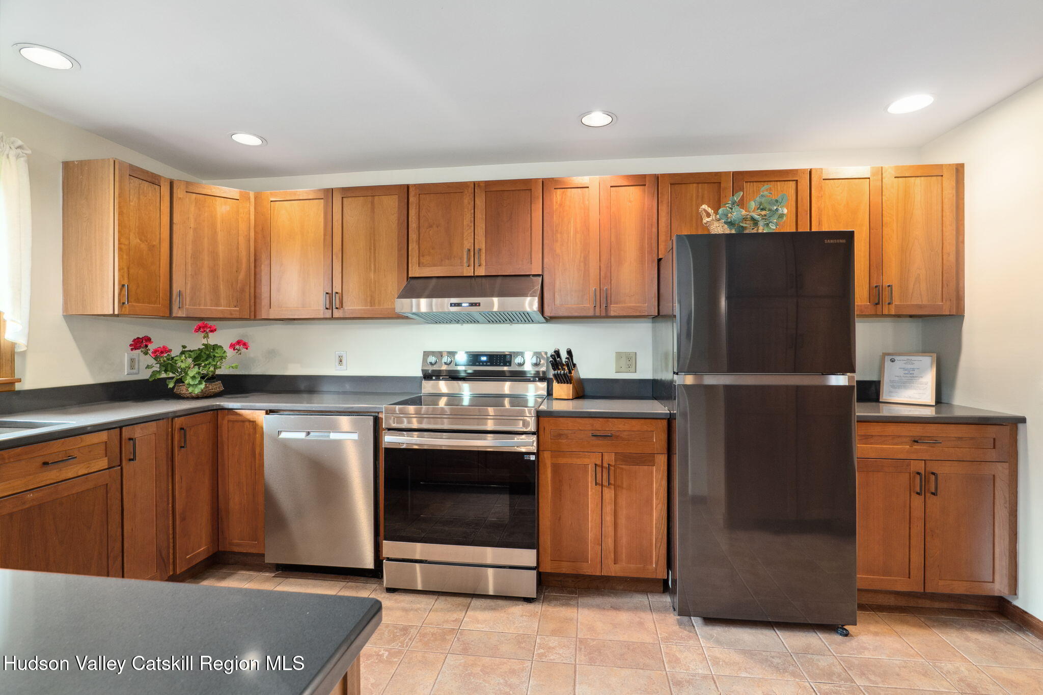 552 Bear Kill Road Gilboa, NY 12076 - Photo 23 of 63 a kitchen with stainless steel appliances granite countertop a refrigerator sink and cabinets