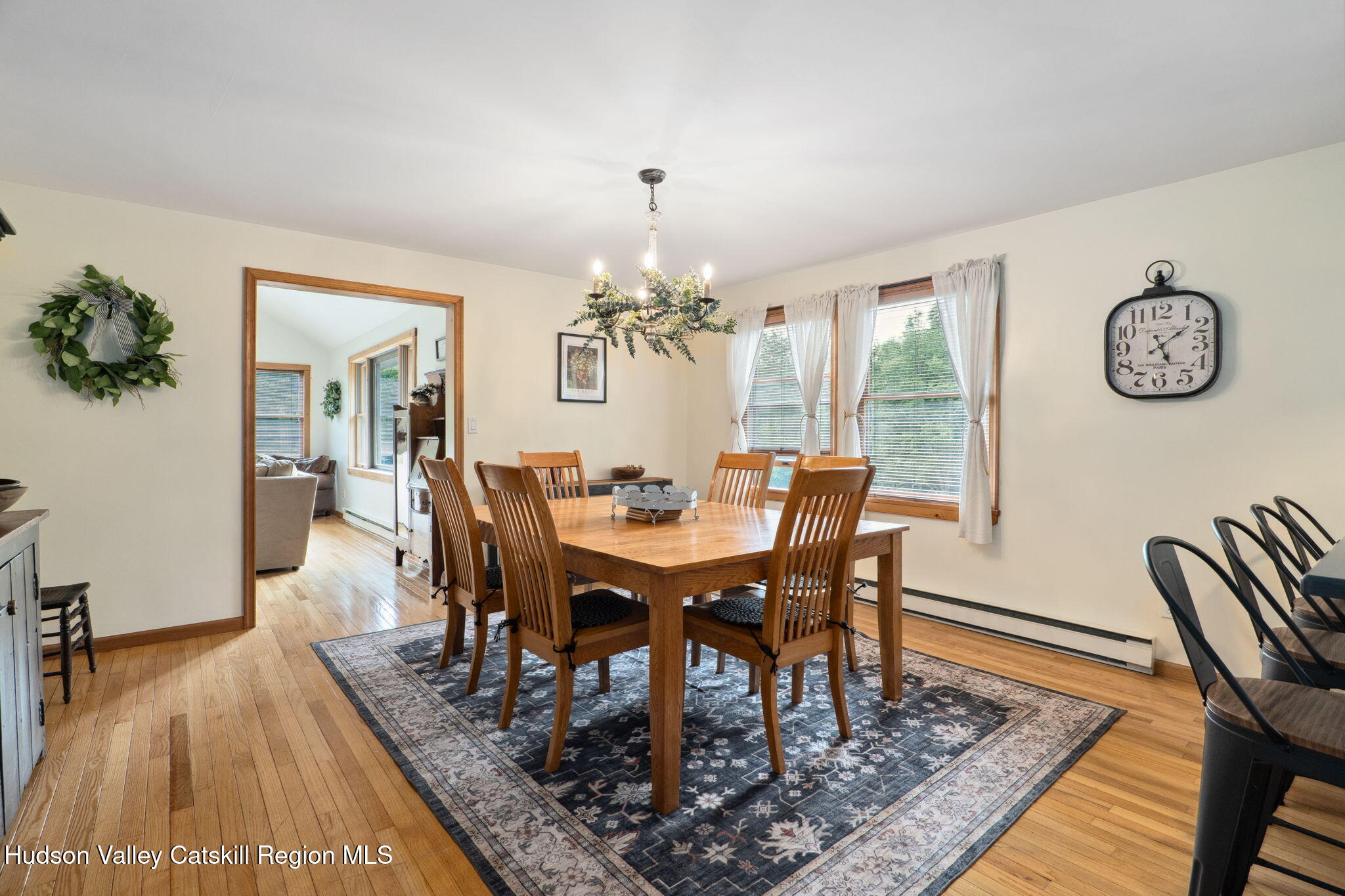 552 Bear Kill Road Gilboa, NY 12076 - Photo 25 of 63 a view of a dining room with furniture wooden floor and a chandelier
